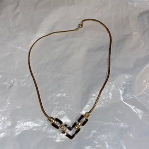 Black and gold color necklace